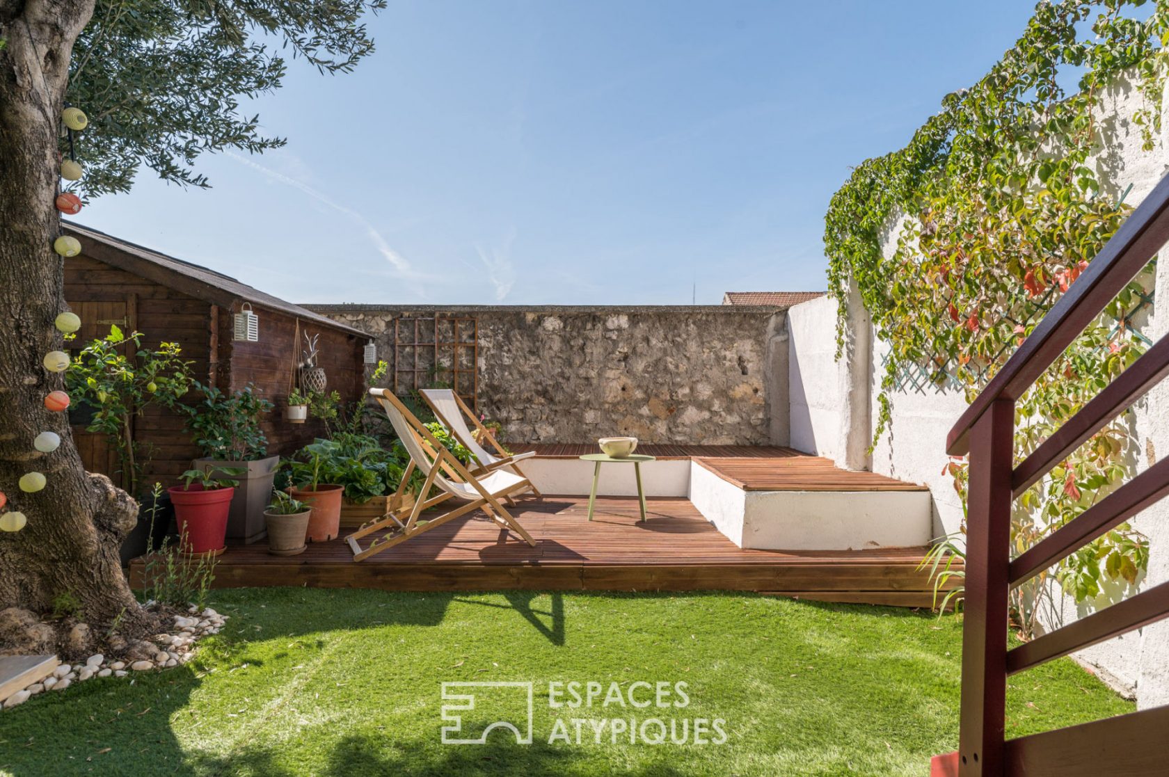 Appartement de type loft avec terrasse et jardin