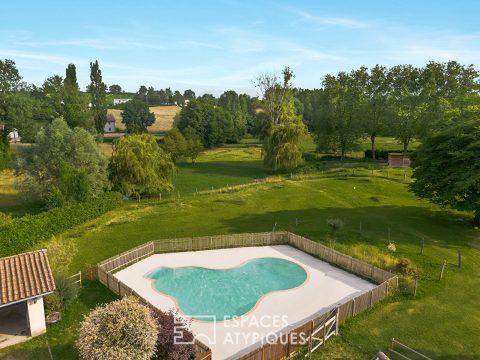 Ancien corps de ferme rénové au sein d’un parc