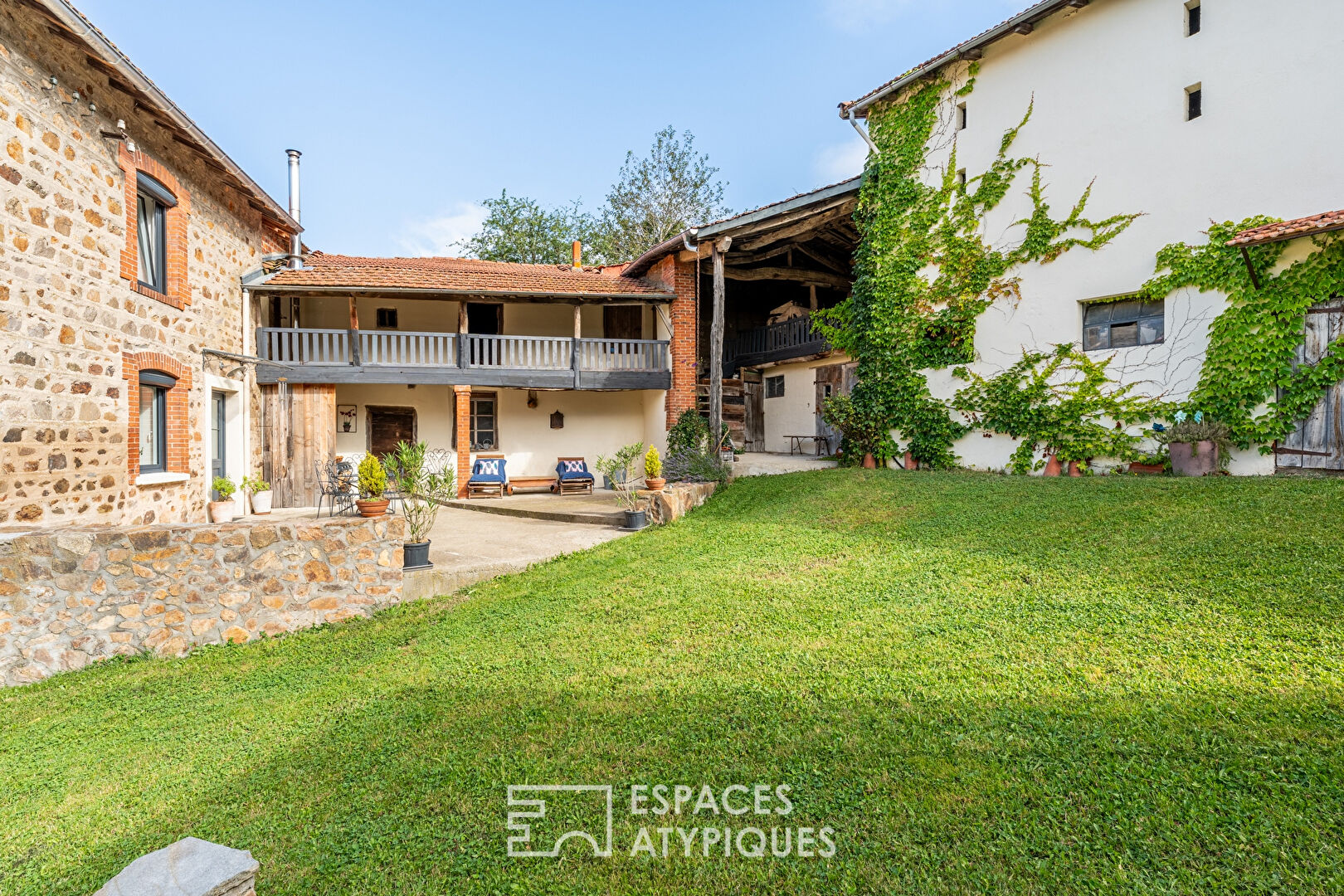 Old renovated farmhouse with outbuildings