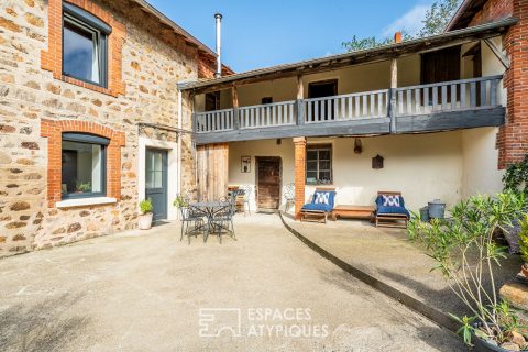 Old renovated farmhouse with outbuildings