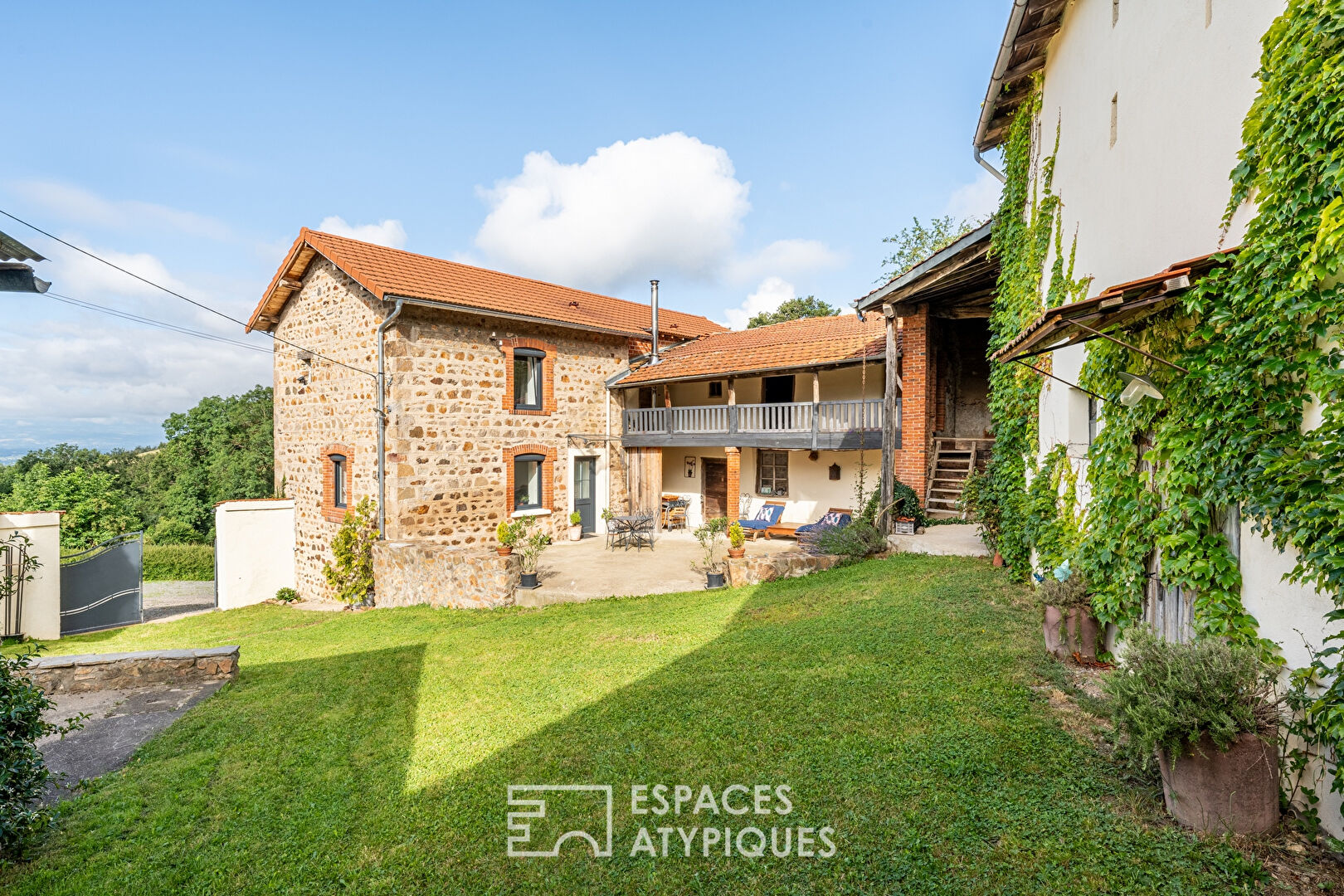 Old renovated farmhouse with outbuildings