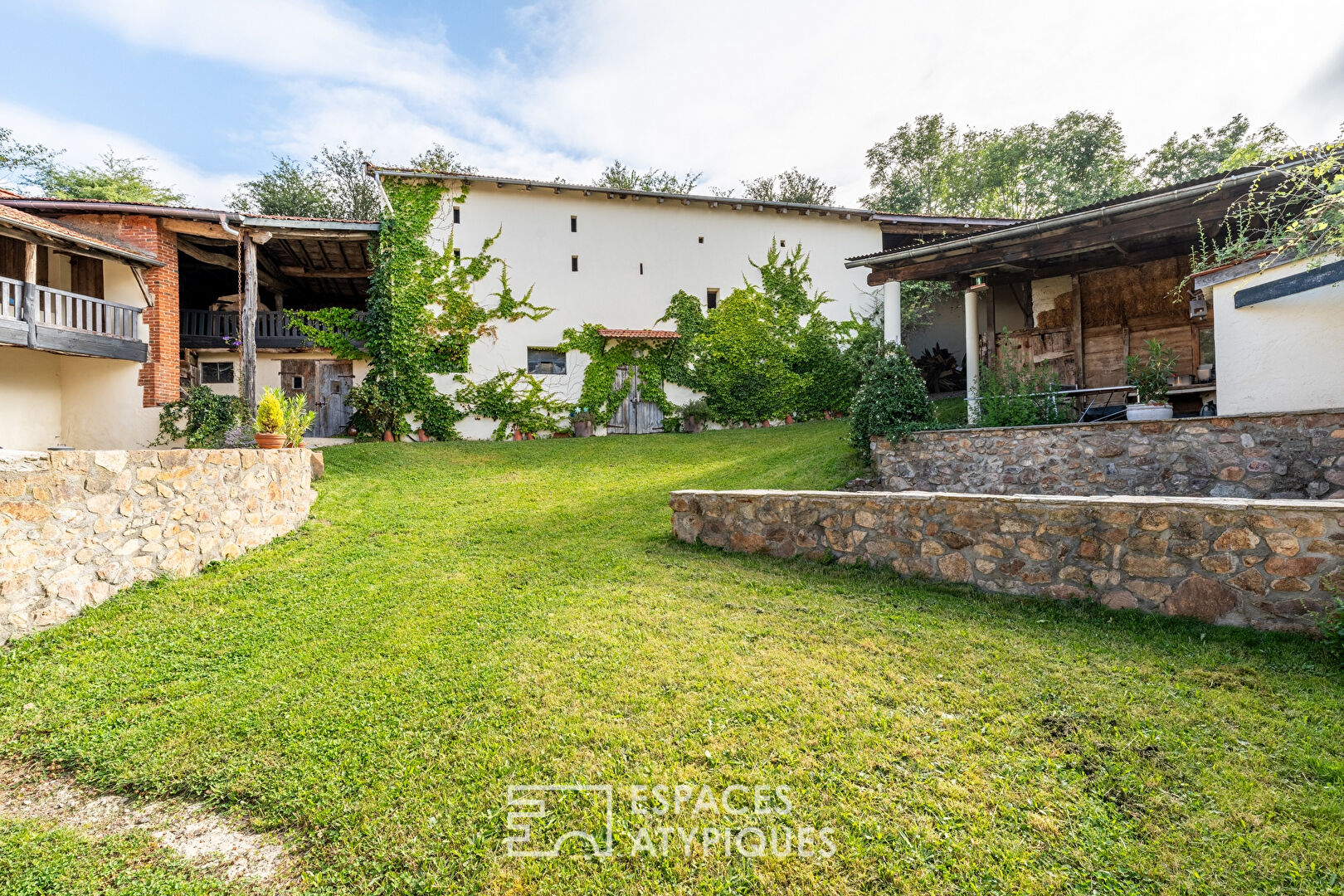 Old renovated farmhouse with outbuildings