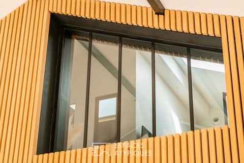 Maison pensée comme un loft avec terrasse et garage