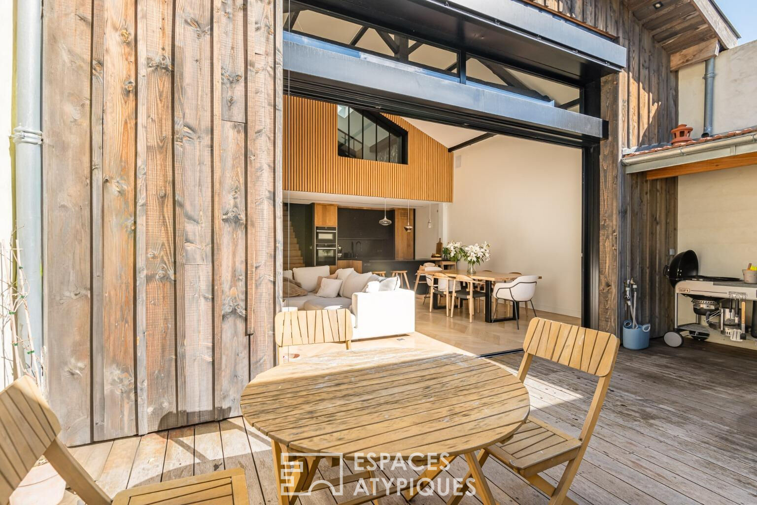 Maison pensée comme un loft avec terrasse et garage