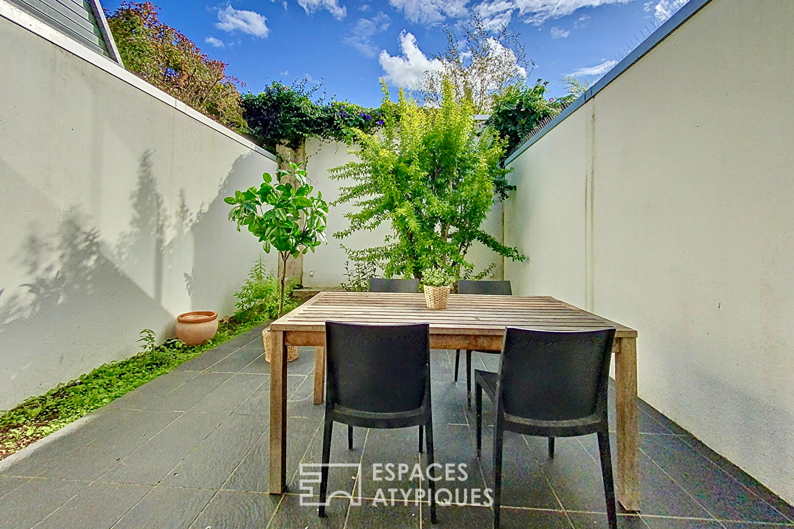 Loft industriel avec terrasse végétalisée