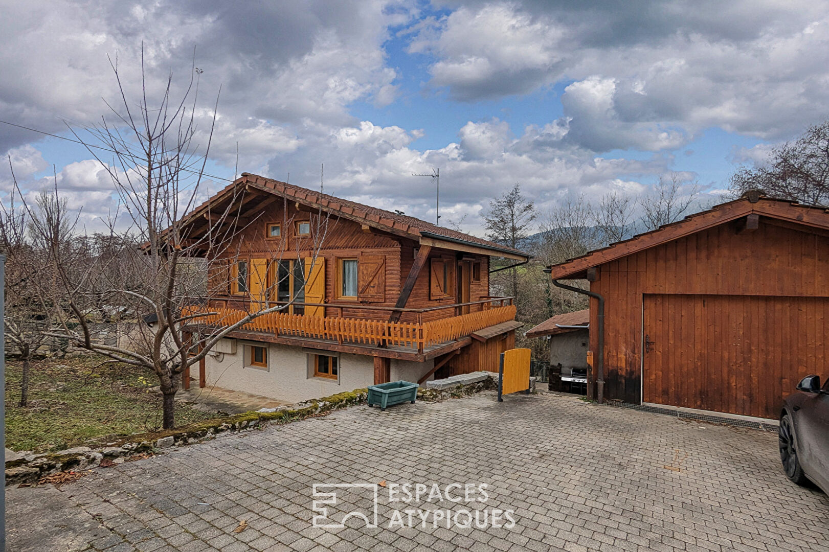 Chalet-style house with outbuildings