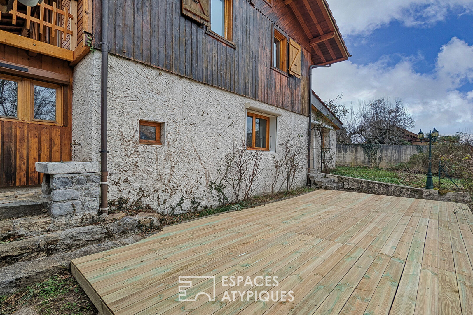 Chalet-style house with outbuildings