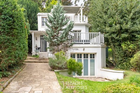 Art Deco house with cascading terraces and outbuilding in a bucolic garden