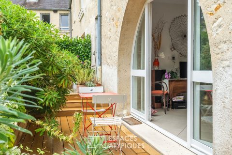 Appartement en rez de jardin avec terrasse dans un ancien corps de ferme