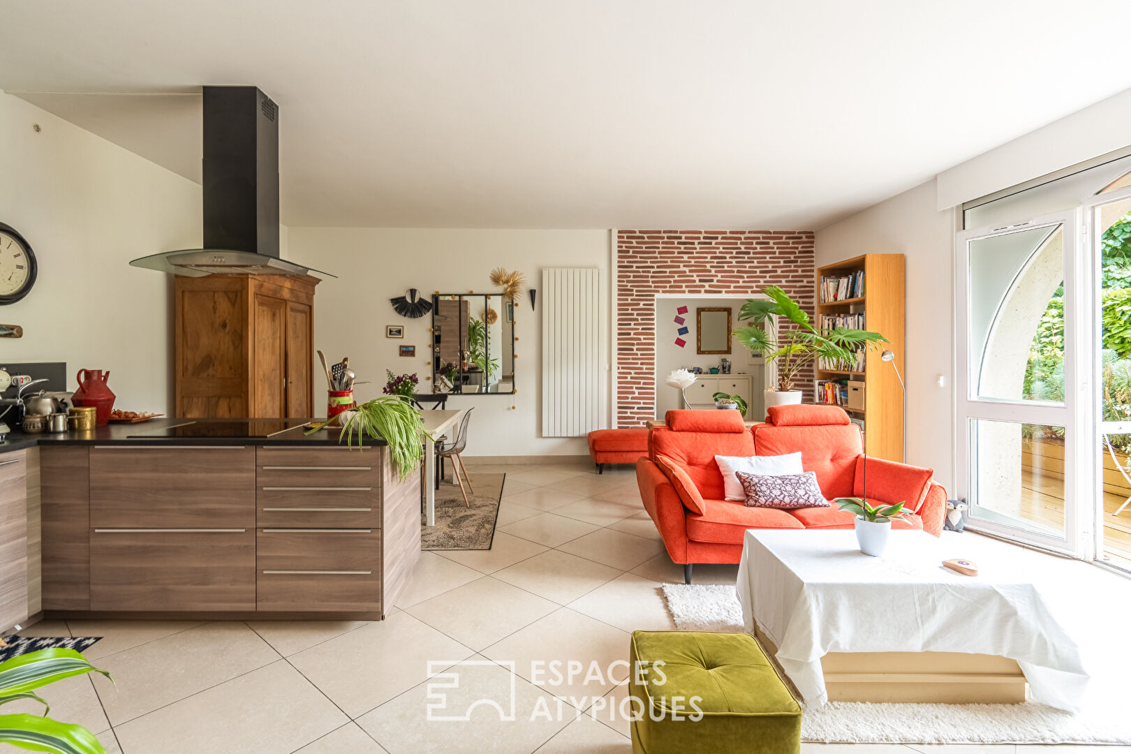 Appartement en rez de jardin avec terrasse dans un ancien corps de ferme