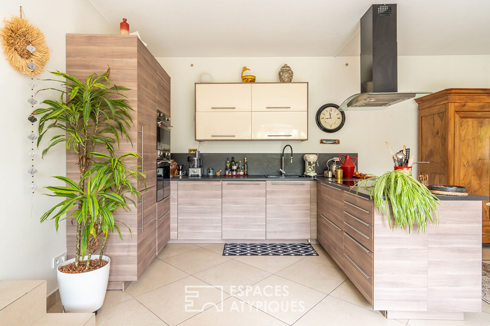 Appartement en rez de jardin avec terrasse dans un ancien corps de ferme