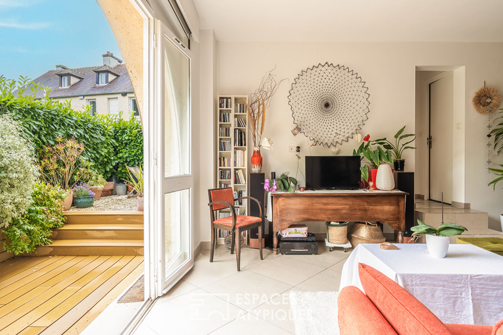 Appartement en rez de jardin avec terrasse dans un ancien corps de ferme