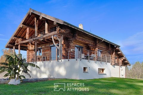 Real log cabin with view of the Pre-Alps