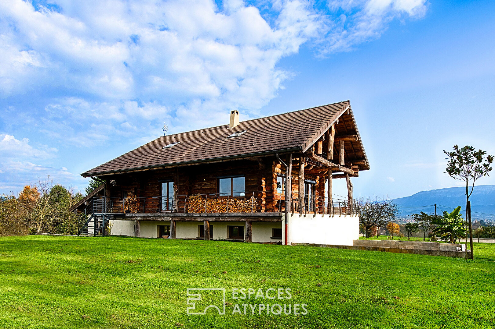 Real log cabin with view of the Pre-Alps