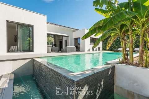 Contemporary single storey villa and lush garden