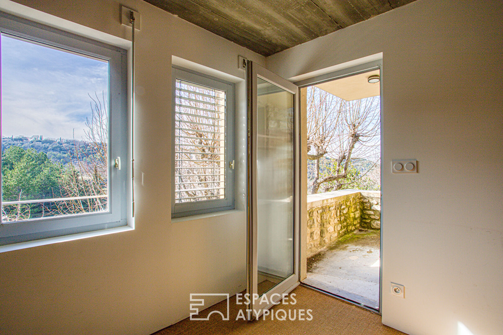 Old house and its contemporary extension with view.