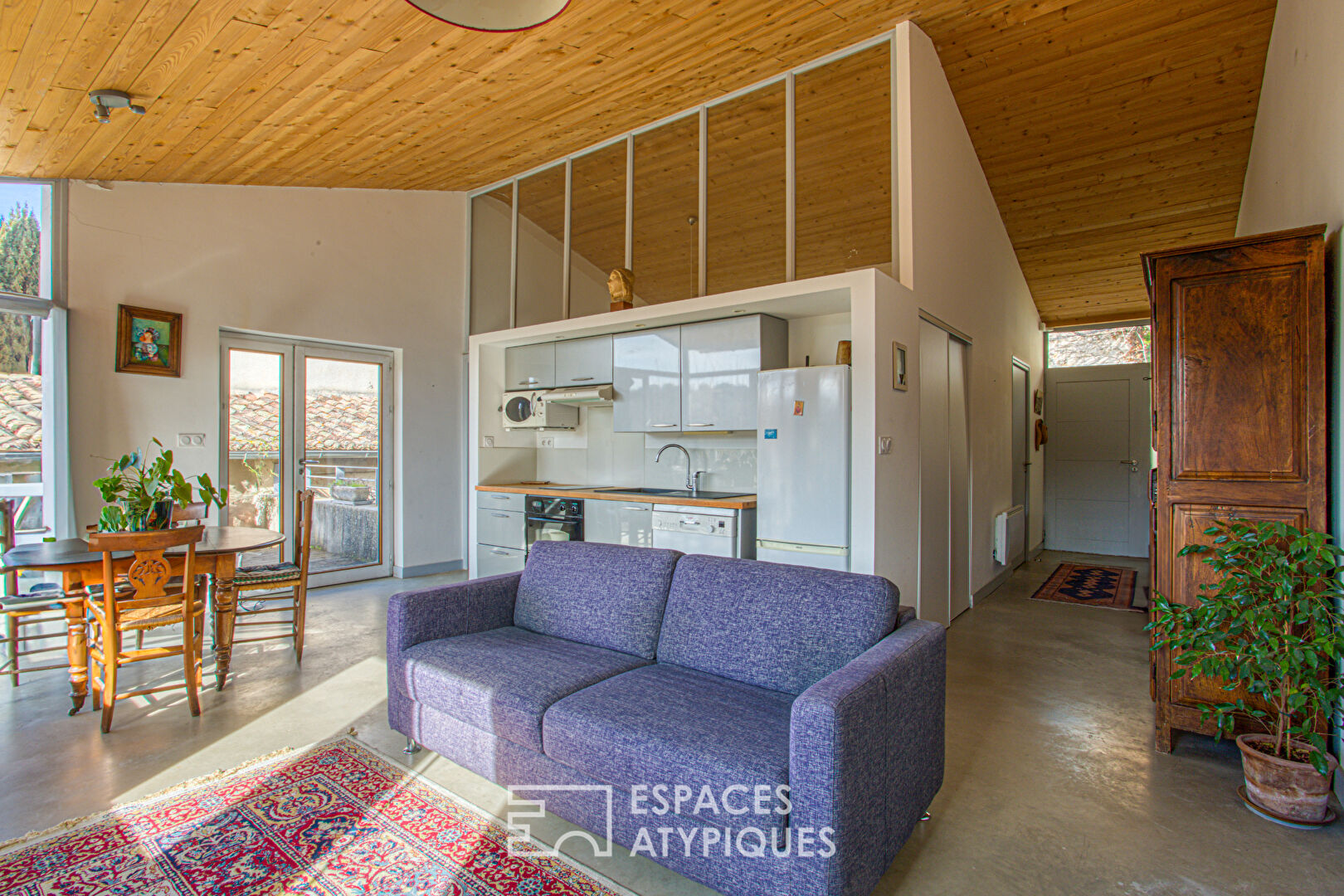 Old house and its contemporary extension with view.