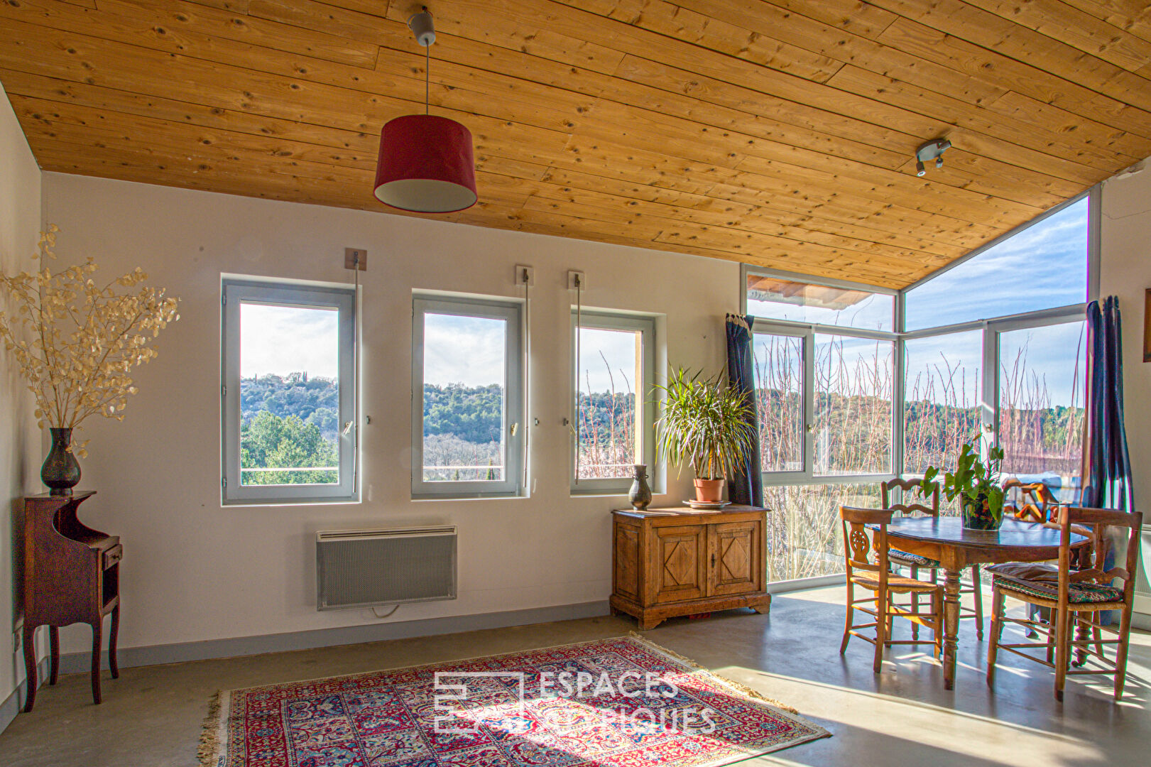 Old house and its contemporary extension with view.