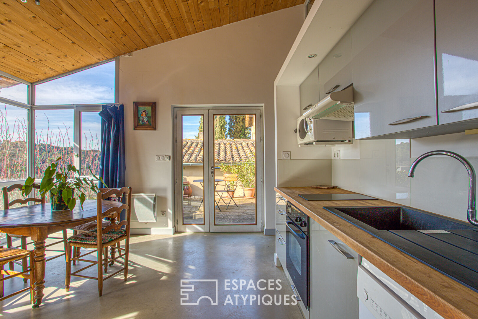 Old house and its contemporary extension with view.