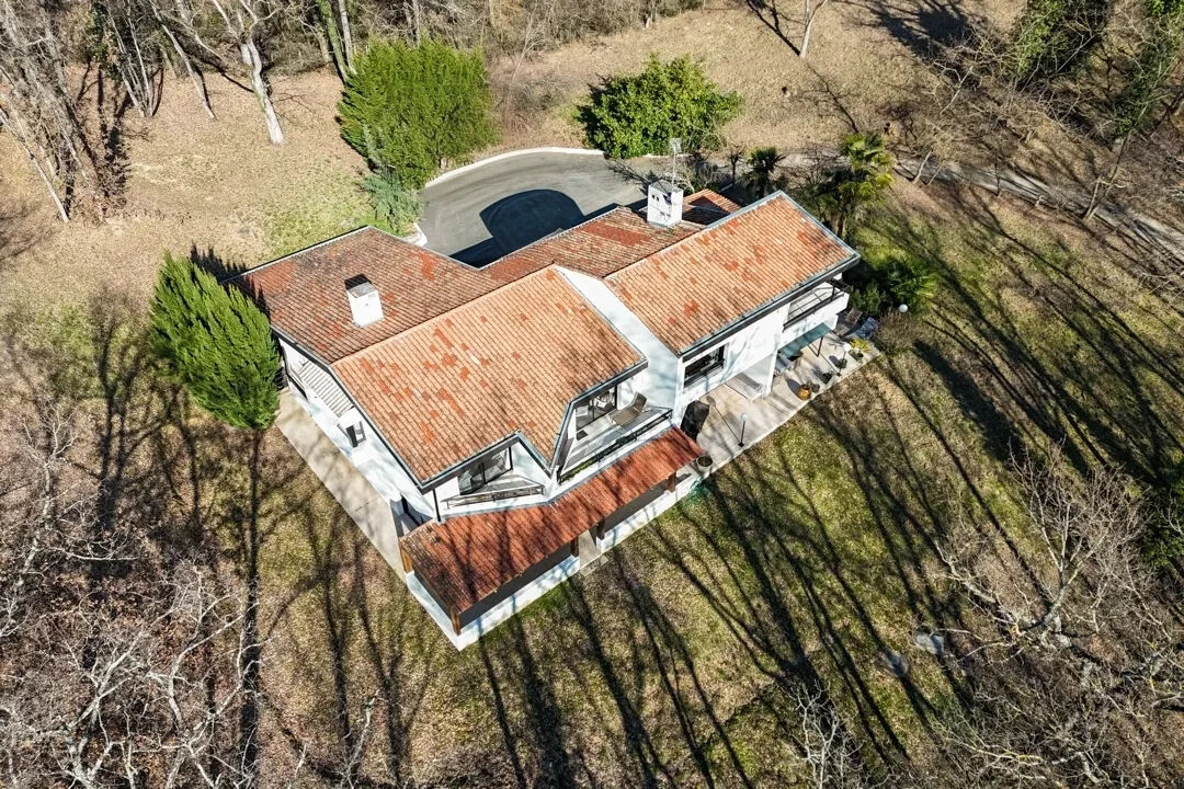 Architect-designed house and its park with woods