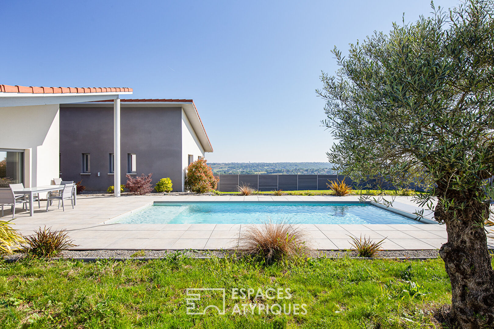 Contemporary with swimming pool and view in Goyrans