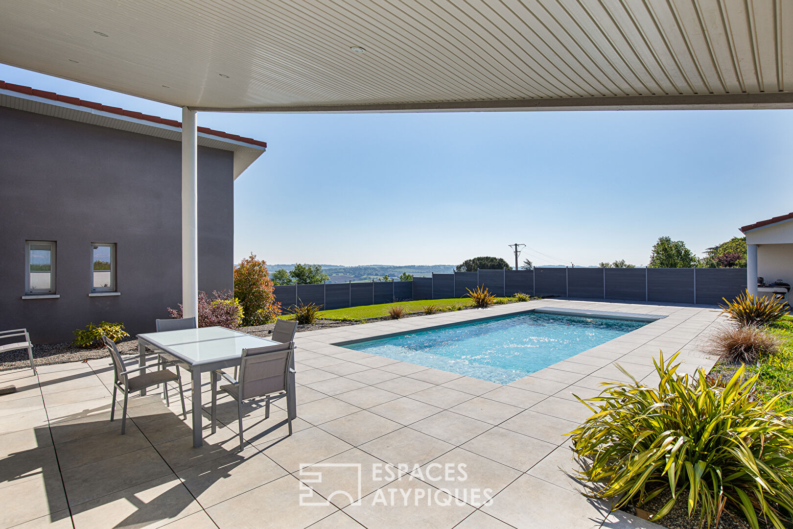 Contemporary with swimming pool and view in Goyrans