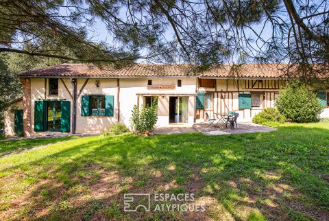 Old half-timbered farmhouse with swimming pool.