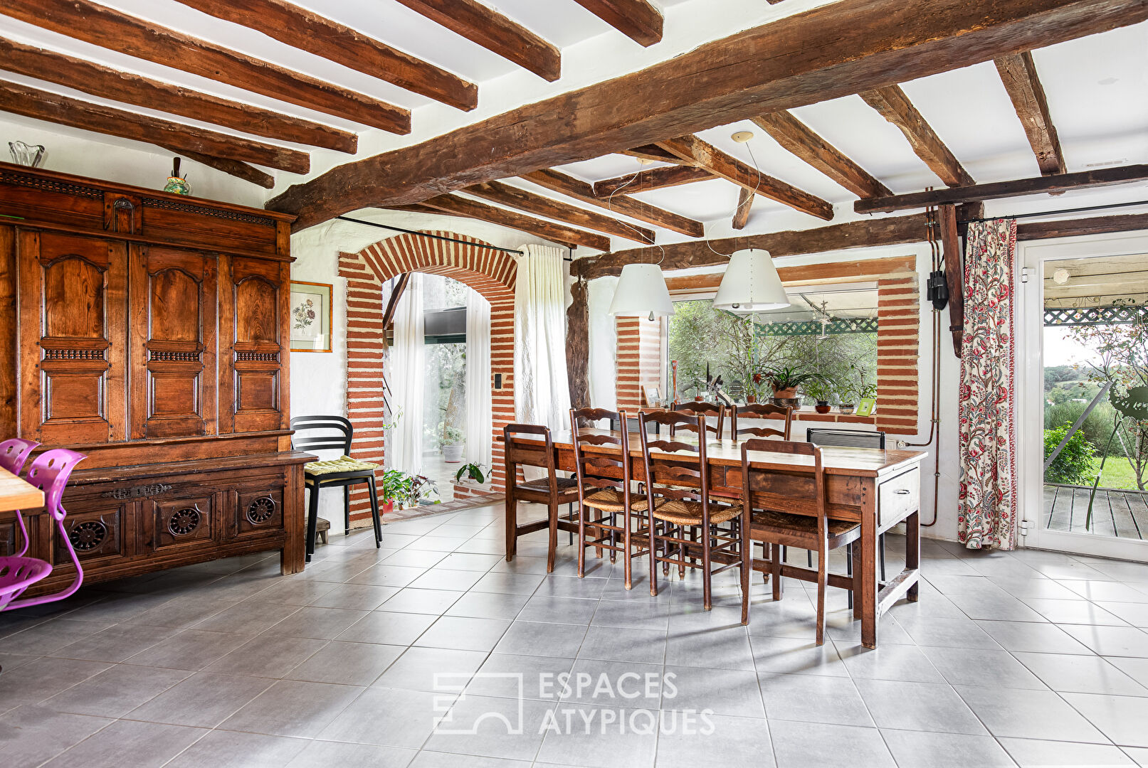 Old half-timbered farmhouse with swimming pool.