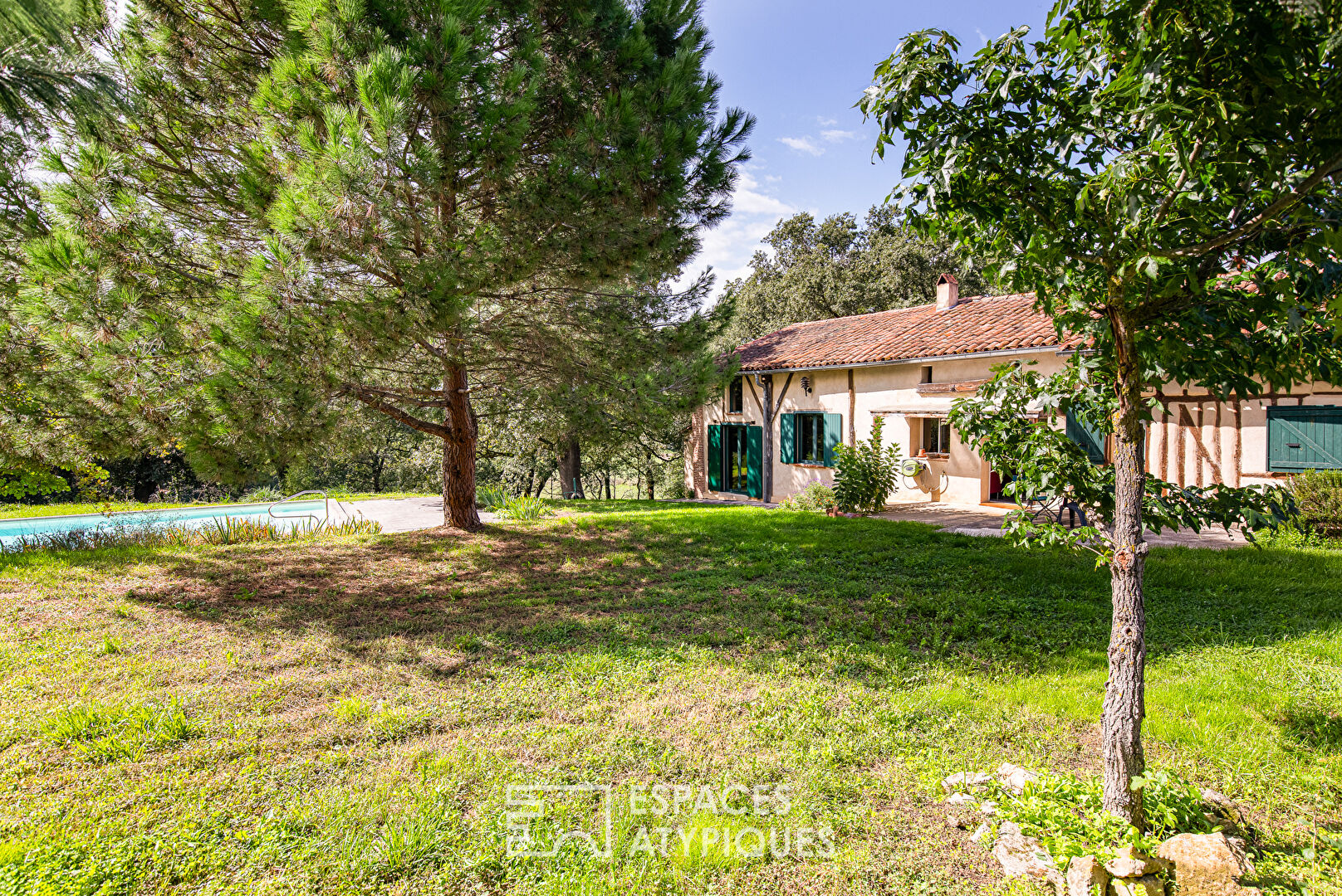 Old half-timbered farmhouse with swimming pool.