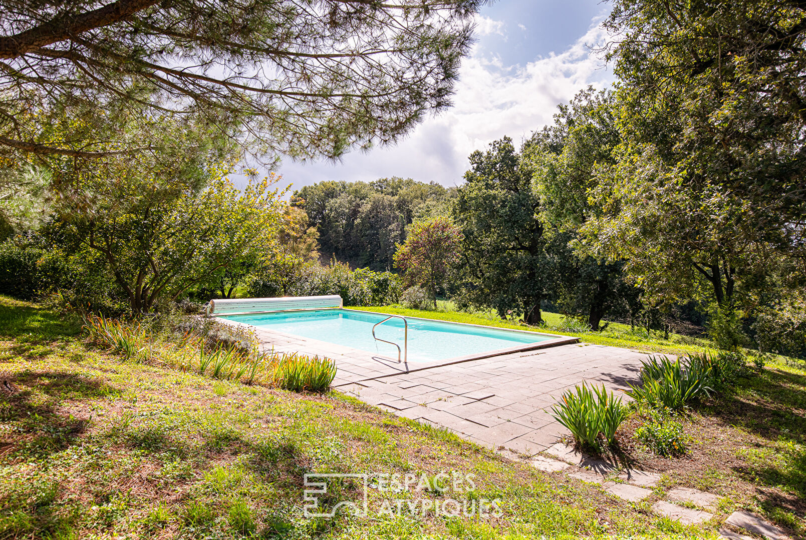 Old half-timbered farmhouse with swimming pool.