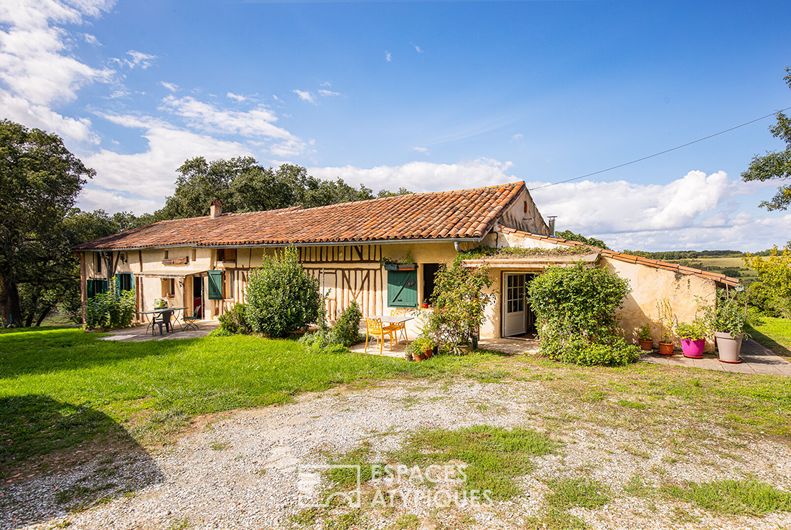 Old half-timbered farmhouse with swimming pool.