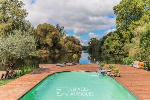 House with character and pool on the water’s edge