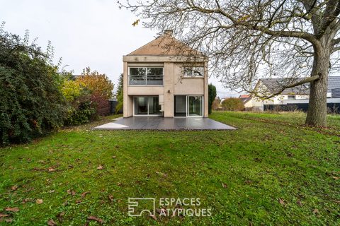 Brutalist-style architect-designed house with garden