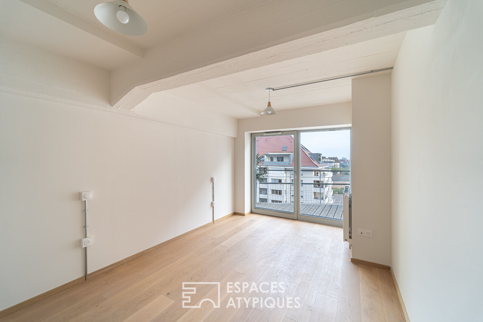 Top-floor loft and its terraces in the Coop district