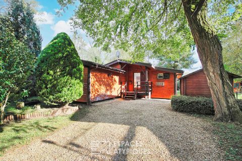 Maison en bois avec terrasse xxl et son jardin