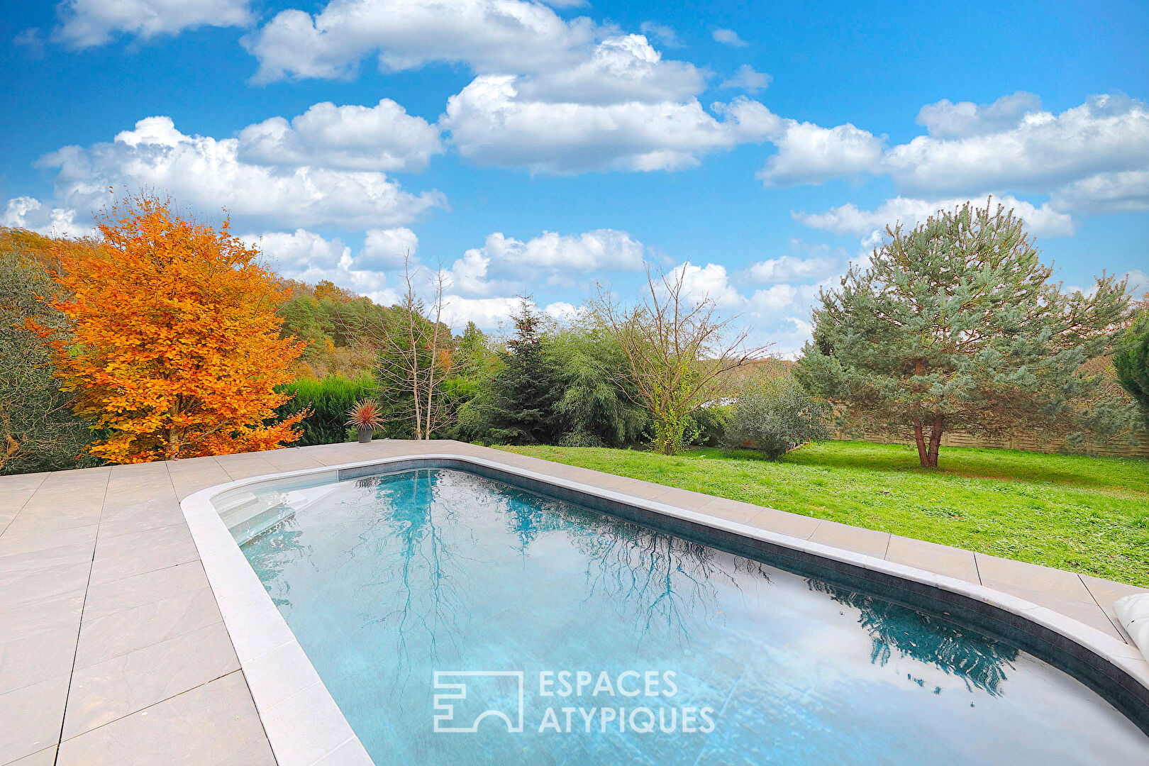 Character house in its green setting with swimming pool