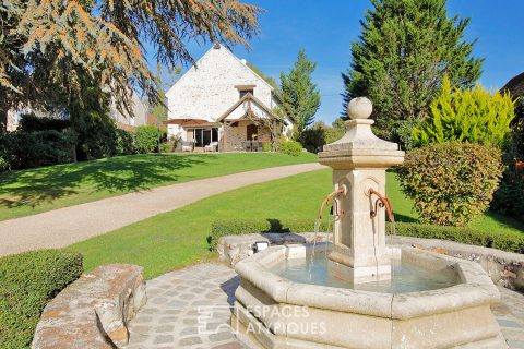 Old renovated honey barn and its landscaped park