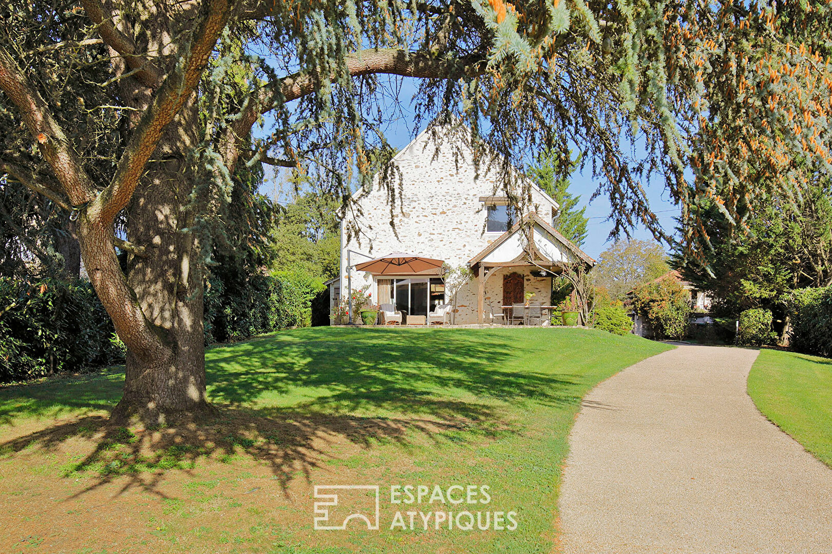 Old renovated honey barn and its landscaped park