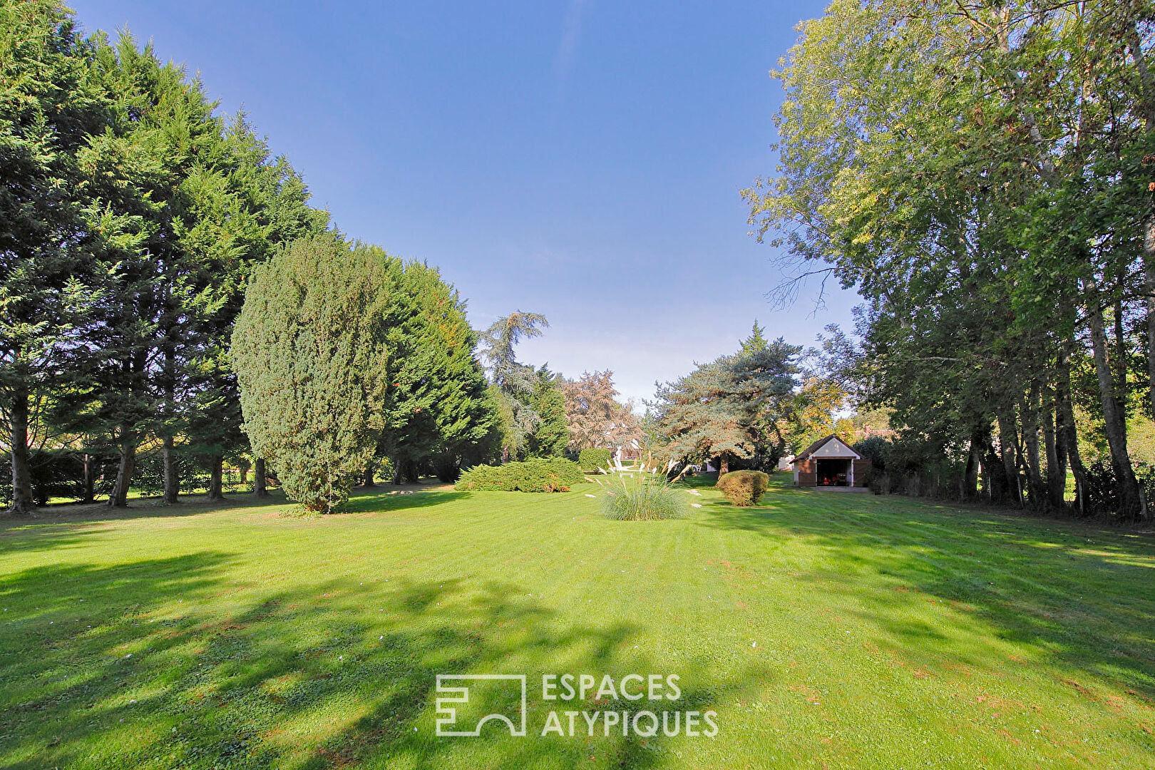 Old renovated honey barn and its landscaped park