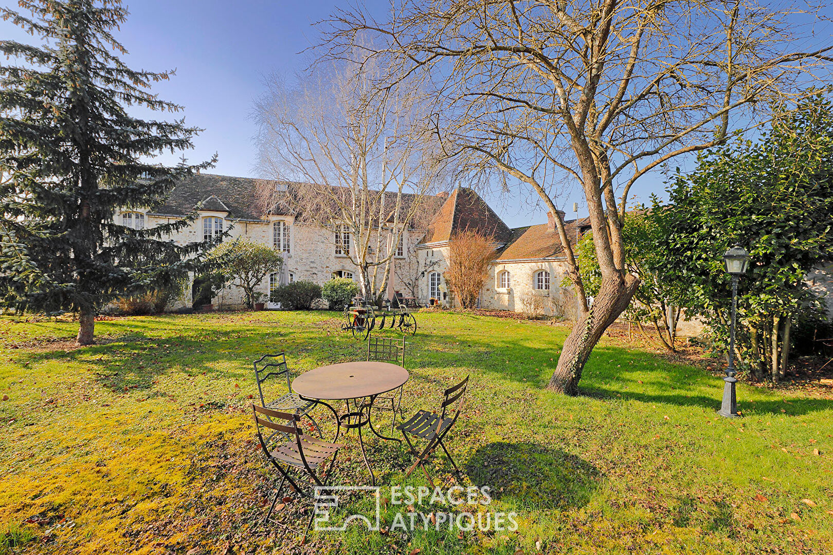 Old farmhouse with garden and outbuildings