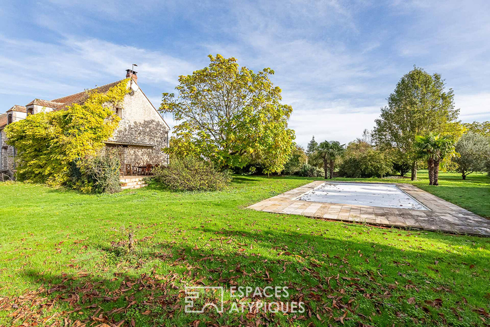 Charming farmhouse with outbuildings and landscaped park