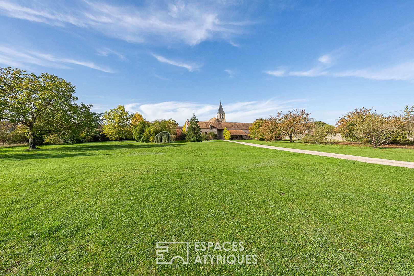 Charming farmhouse with outbuildings and landscaped park