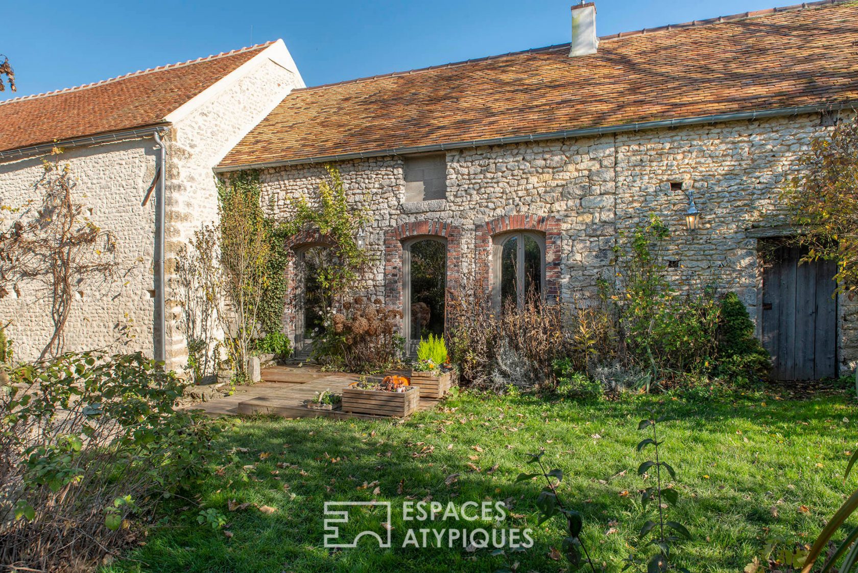 Charming renovated farmhouse with outbuildings and bucolic garden