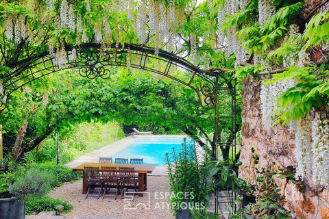 House of character and its landscaped garden, with swimming pool and outbuilding