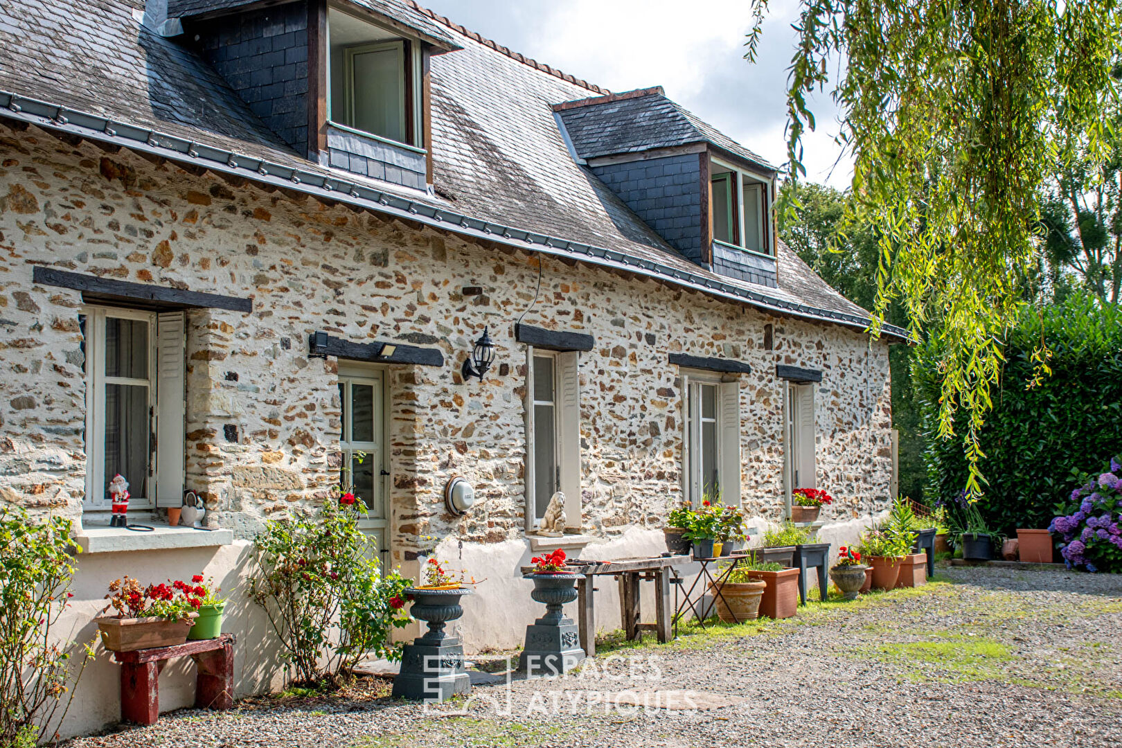 The authentic farmhouse and its pond