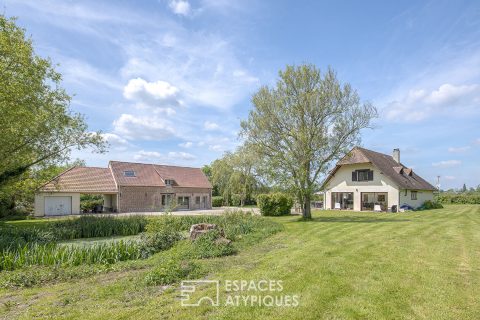 Property with two houses with a view on the countryside