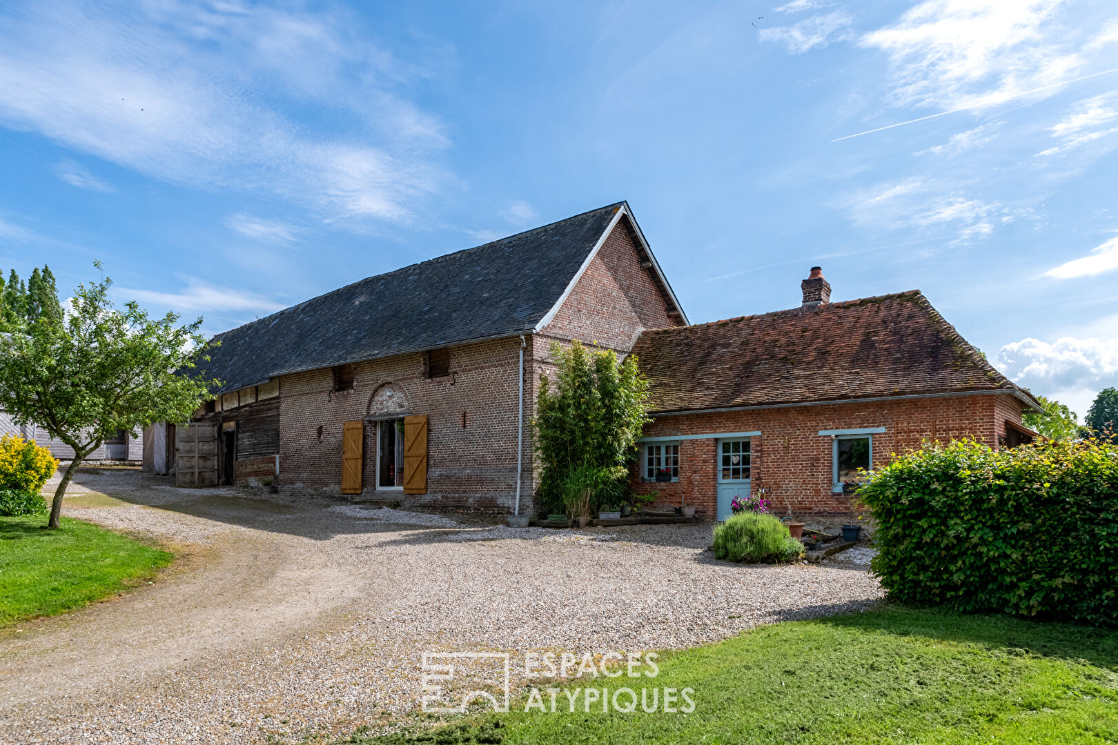 Large family farmhouse and its outbuildings