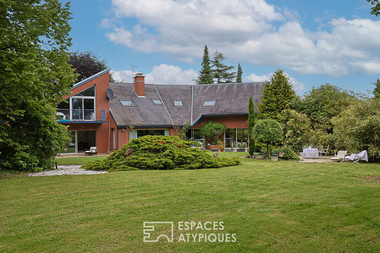 Architect house with swimming pool and park