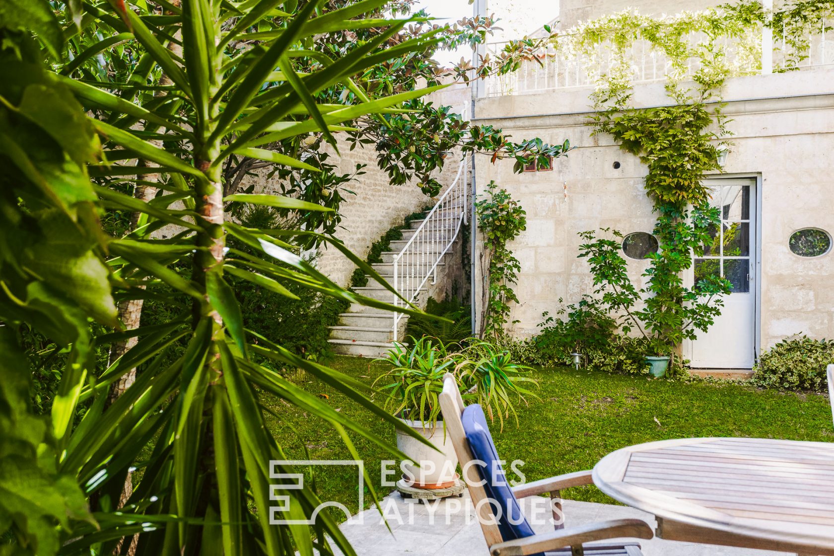 Family home around its tree-lined courtyard