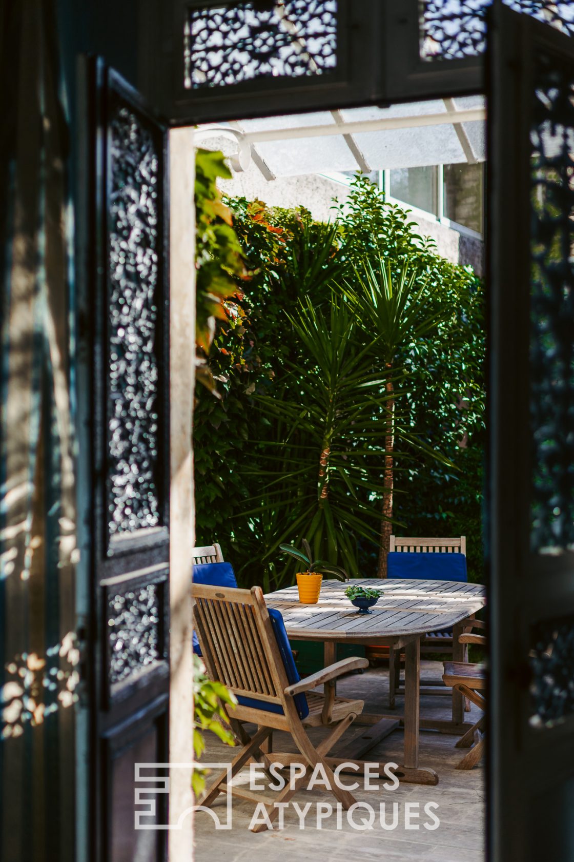 Family home around its tree-lined courtyard